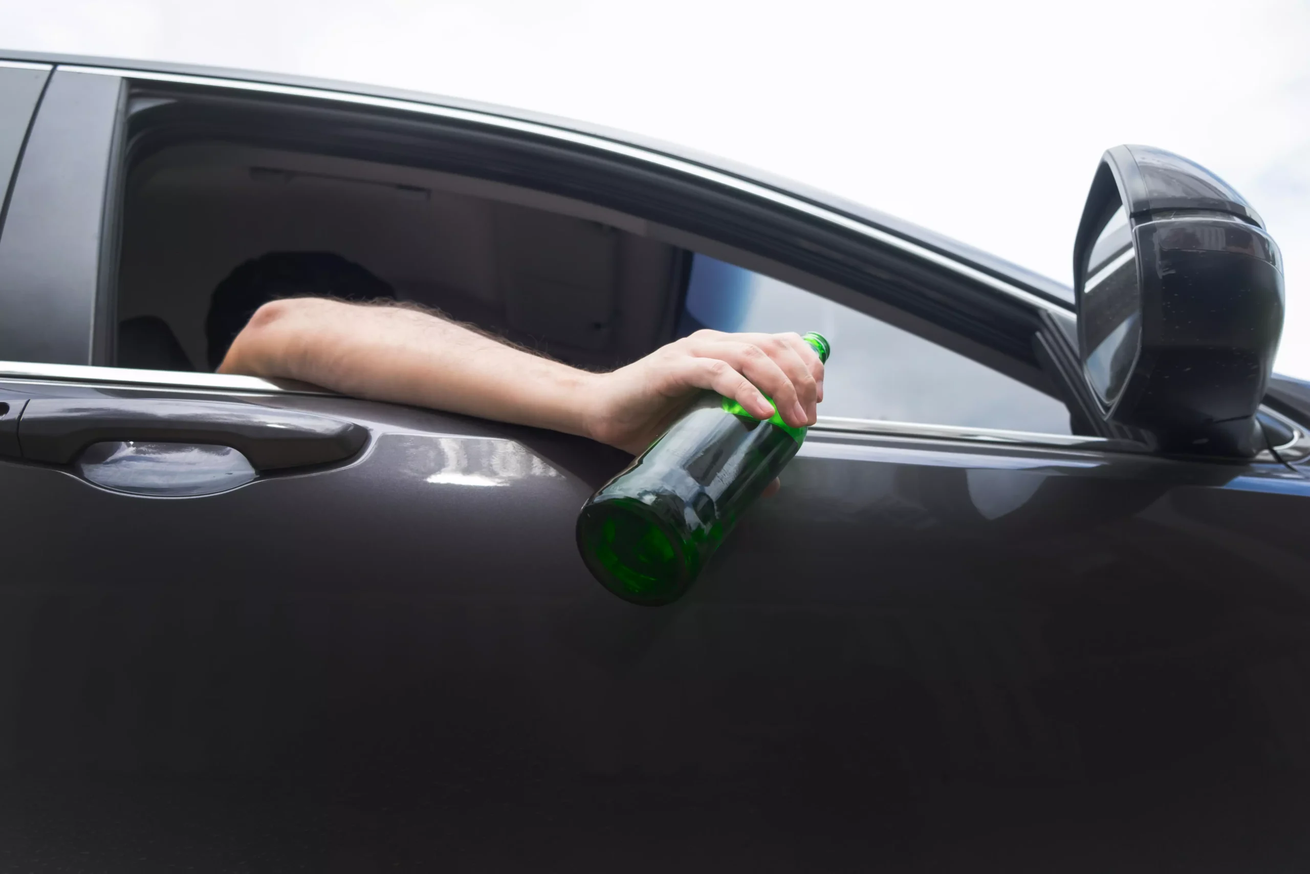 Closeup image of diver holding a bottle